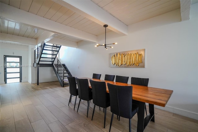 dining area with wood ceiling, beam ceiling, a notable chandelier, and light wood-type flooring