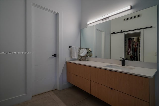 bathroom with vanity and tile patterned floors