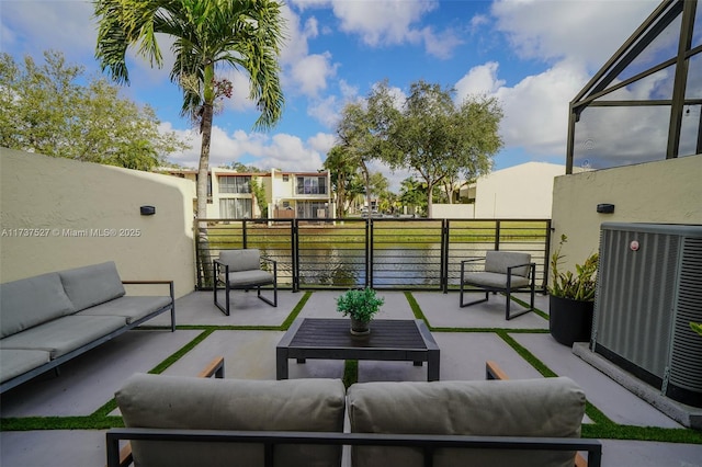 view of patio / terrace featuring cooling unit and an outdoor living space