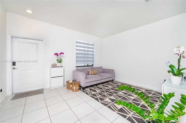 unfurnished living room with light tile patterned flooring