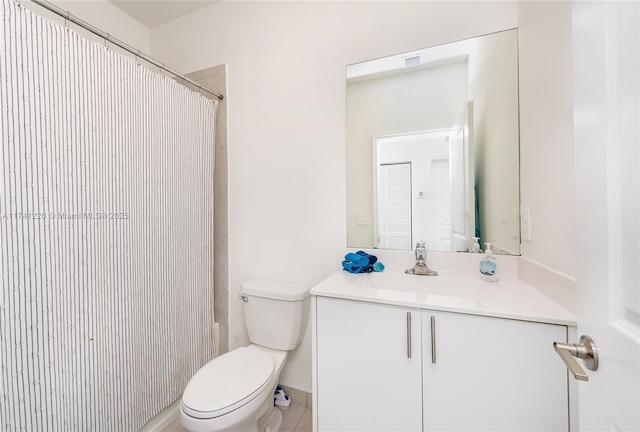 full bathroom with vanity, shower / tub combo with curtain, and toilet