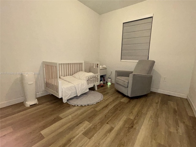 bedroom featuring wood-type flooring