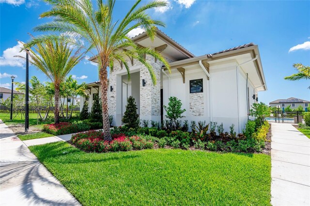 view of home's exterior featuring a lawn