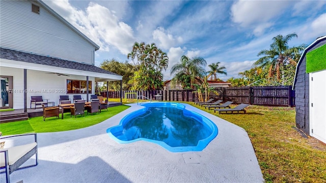 view of pool with a yard, outdoor lounge area, and a patio