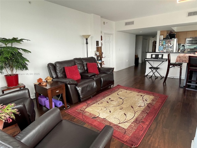 living room featuring dark hardwood / wood-style flooring