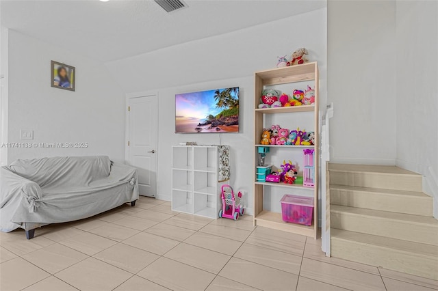 game room with light tile patterned floors and visible vents