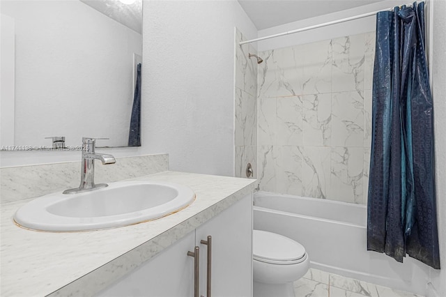 full bath featuring a textured wall, toilet, vanity, marble finish floor, and shower / bath combo with shower curtain