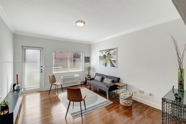 living room with wood-type flooring, a wall mounted air conditioner, and crown molding