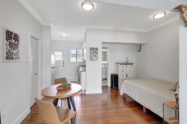 bedroom with ornamental molding, dark wood-type flooring, and refrigerator