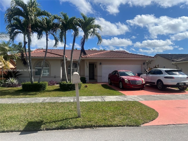 view of front of home with a garage and a front yard