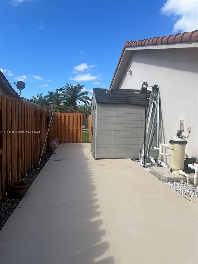 view of patio / terrace with a shed