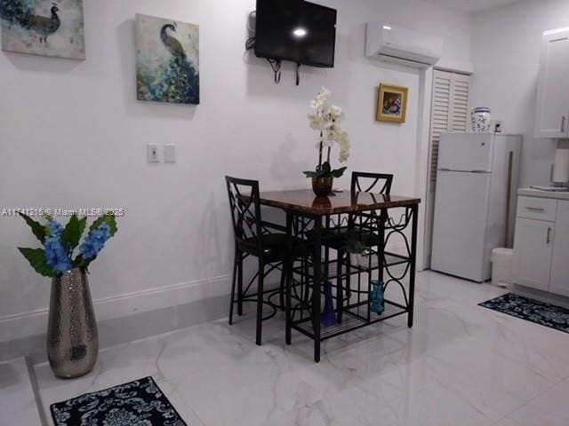 dining room featuring a wall mounted air conditioner