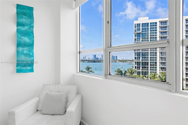 interior space featuring a water view and a city view