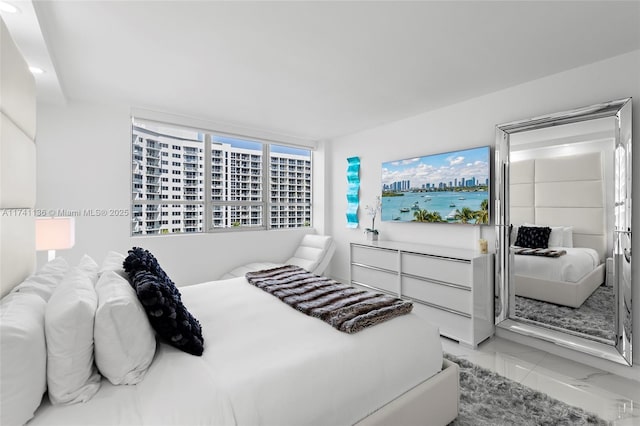 bedroom featuring marble finish floor