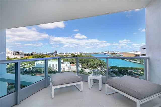 balcony featuring a water view