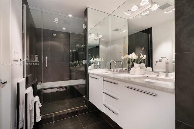 bathroom featuring tile patterned flooring, vanity, and an enclosed shower