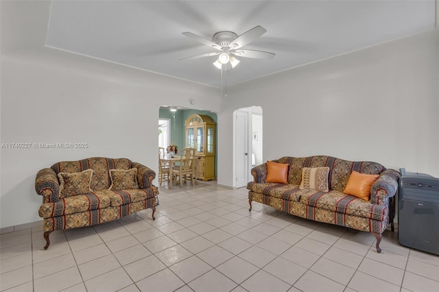 tiled living room featuring ceiling fan