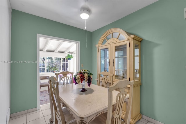 dining space featuring light tile patterned floors