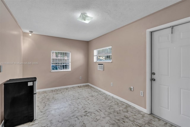 empty room with a textured ceiling