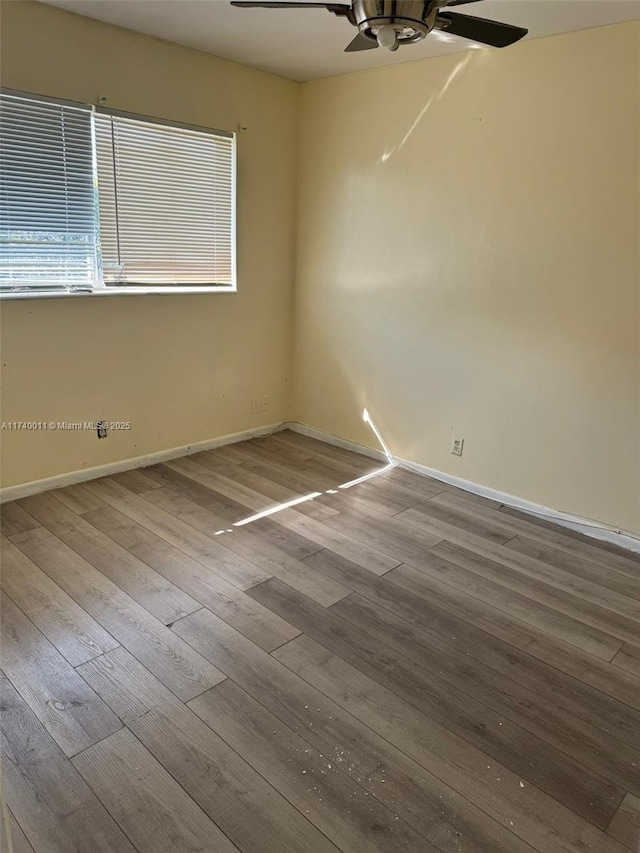 unfurnished room featuring ceiling fan and hardwood / wood-style floors