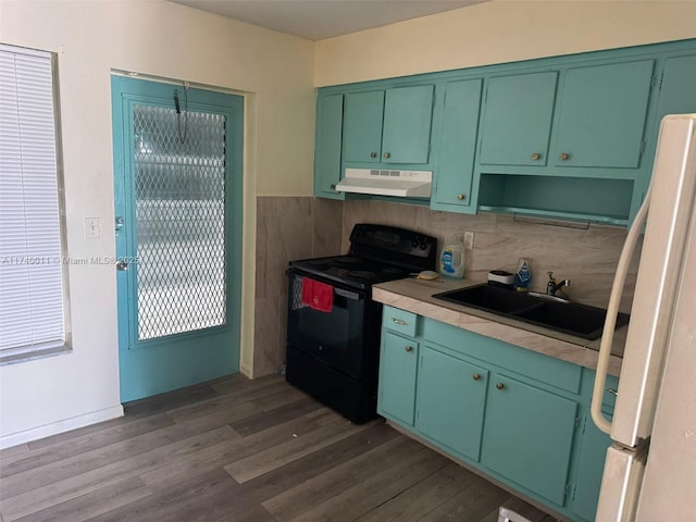 kitchen featuring sink, green cabinetry, dark hardwood / wood-style flooring, black range with electric cooktop, and white fridge