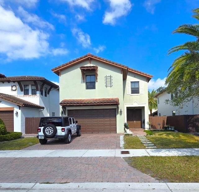 mediterranean / spanish-style home featuring a garage