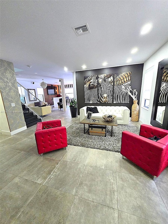 living room featuring a healthy amount of sunlight and a textured ceiling