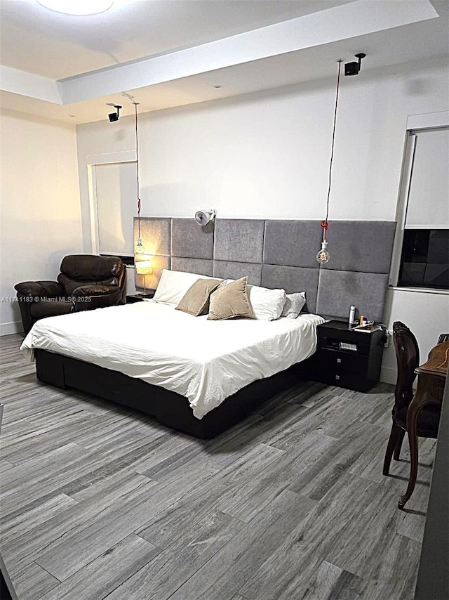 bedroom featuring hardwood / wood-style flooring