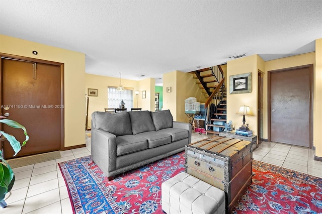 tiled living room with a textured ceiling