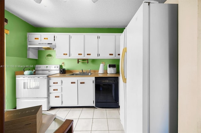 kitchen featuring light tile patterned flooring, sink, white cabinets, white appliances, and a textured ceiling