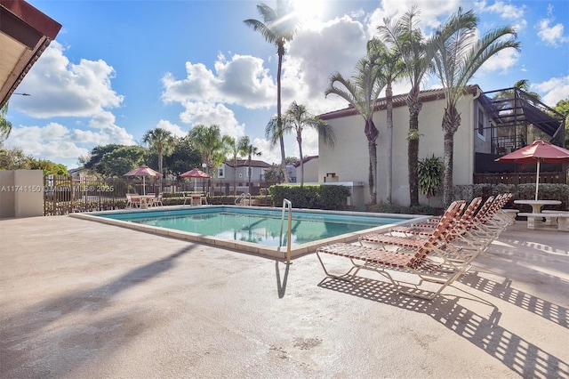 view of swimming pool featuring a patio area