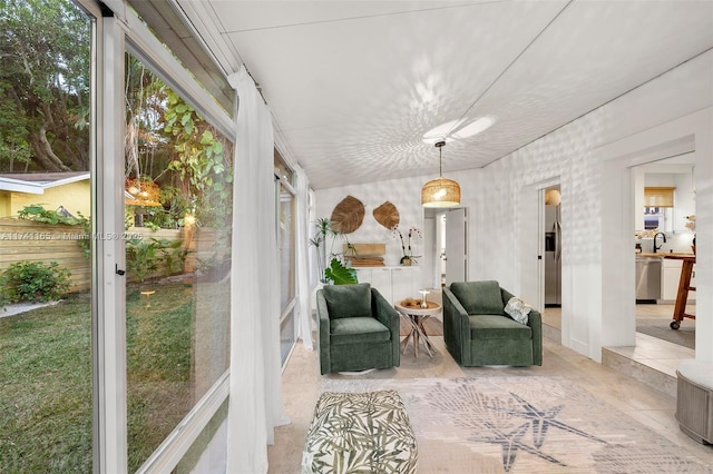 sunroom / solarium with sink