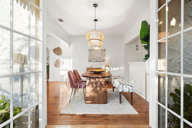 sitting room with hardwood / wood-style floors and ornamental molding