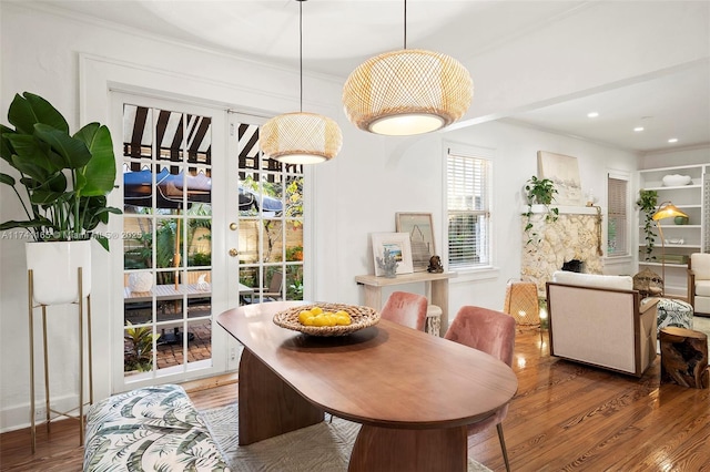 dining room featuring crown molding and dark hardwood / wood-style floors