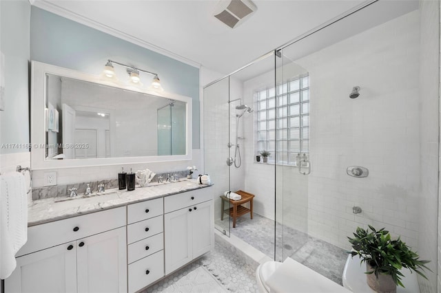 bathroom featuring walk in shower, ornamental molding, toilet, and vanity