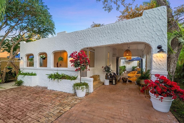 view of front of home with a patio