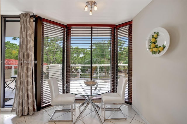 unfurnished dining area featuring plenty of natural light and light tile patterned floors