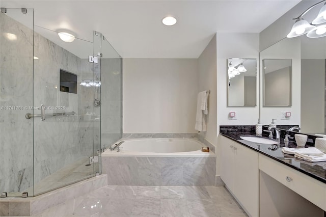 bathroom featuring independent shower and bath and vanity