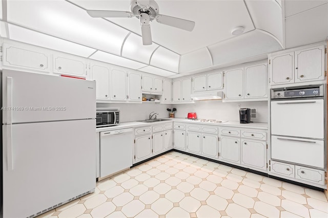 kitchen with ceiling fan, sink, white cabinets, and white appliances