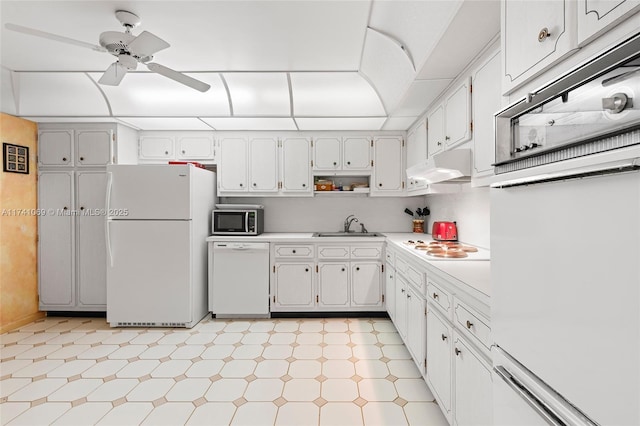 kitchen featuring white cabinetry, sink, ceiling fan, and white appliances