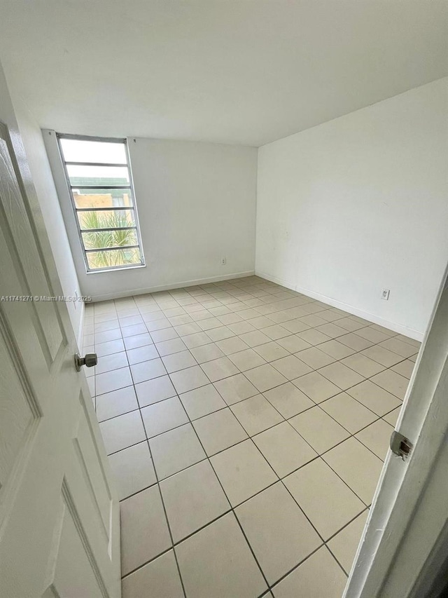 view of tiled spare room