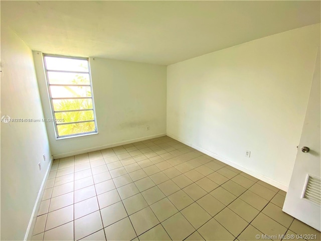 view of tiled spare room