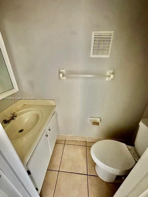 8600 SW 109th Ave Unit 4-216, Miami, FL 33173 - half bath featuring toilet, vanity, tile patterned flooring, and baseboards