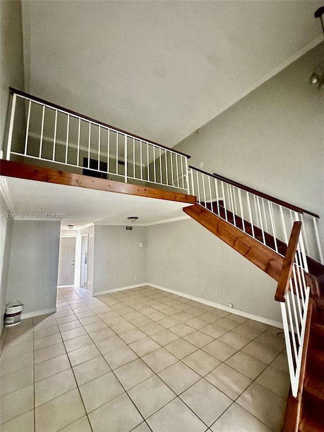 8600 SW 109th Ave Unit 4-216, Miami, FL 33173 - stairs with tile patterned flooring, baseboards, and high vaulted ceiling