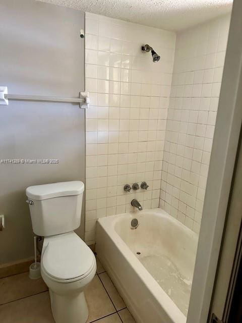 8600 SW 109th Ave Unit 4-216, Miami, FL 33173 - bathroom with tile patterned flooring, toilet, a textured ceiling, and bathing tub / shower combination