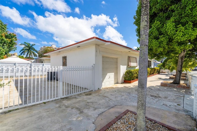 view of property exterior featuring a garage