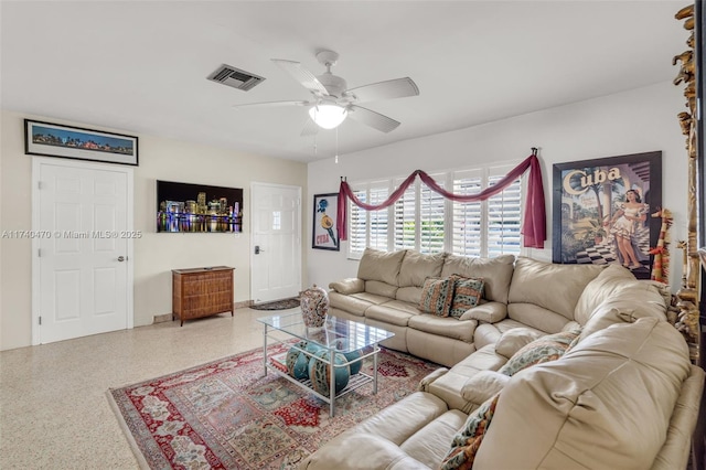 living room featuring ceiling fan