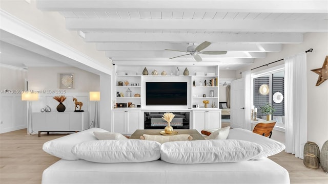 living room with ceiling fan, beam ceiling, and light wood-type flooring