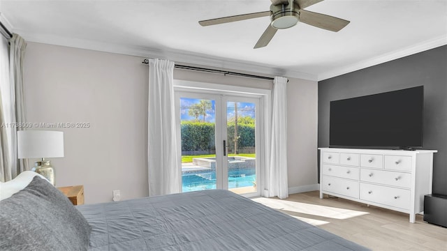 bedroom with french doors, access to outside, ornamental molding, ceiling fan, and light hardwood / wood-style floors