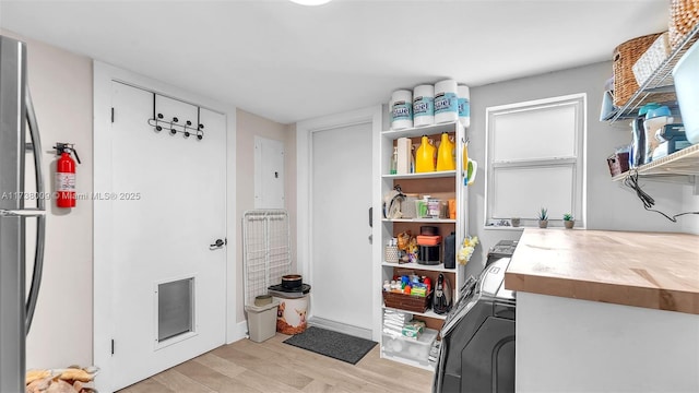 laundry area featuring light hardwood / wood-style floors